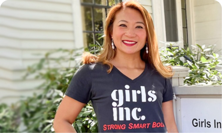 Woman wearing a Girls Inc shirt