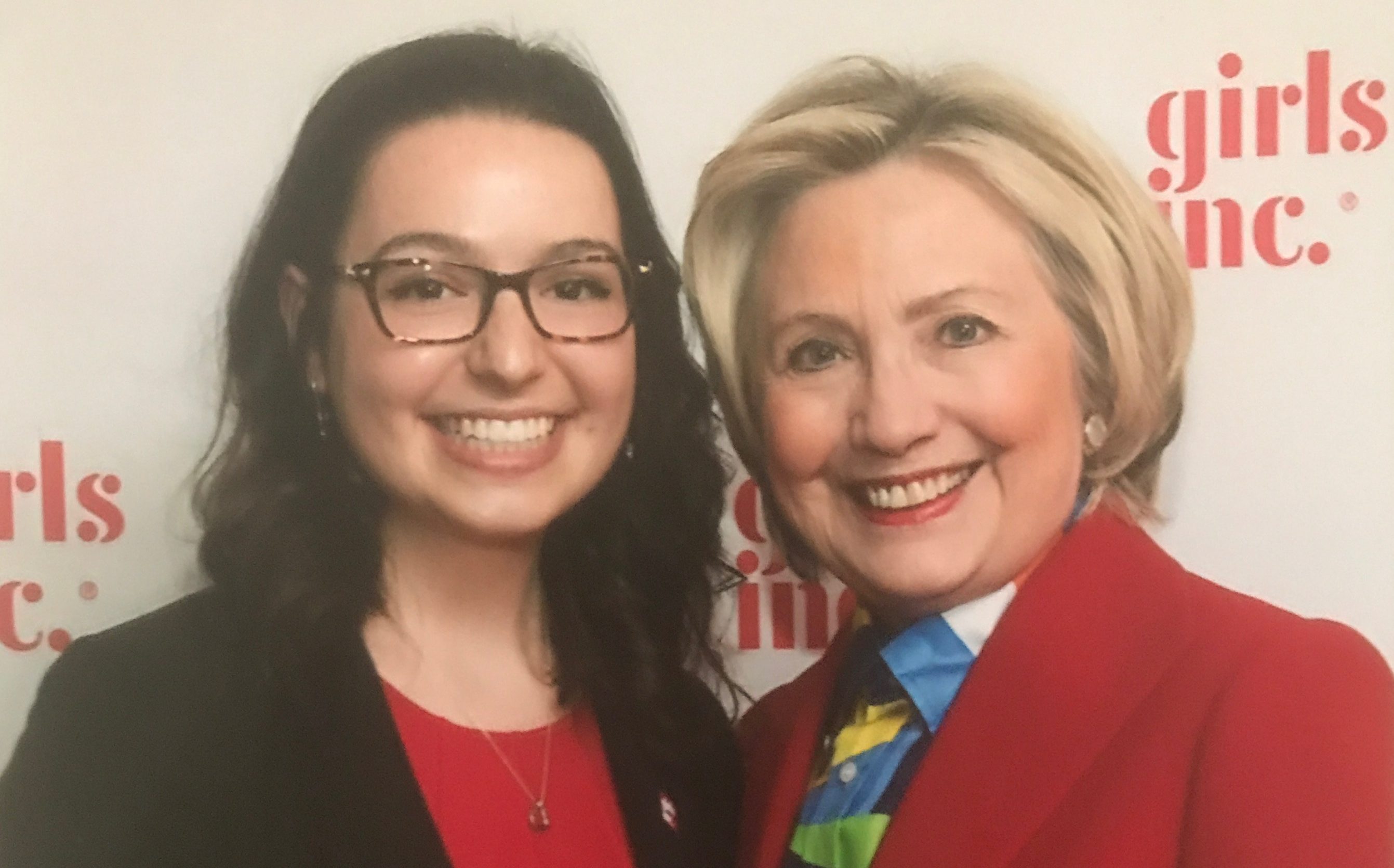 Alumna Mary Carmen with former U.S. Secretary of State Hillary Clinton.